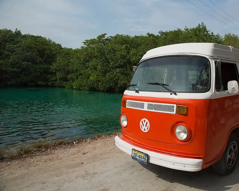 Travellers exploring the Riviera Maya in a classic VW Kombi
